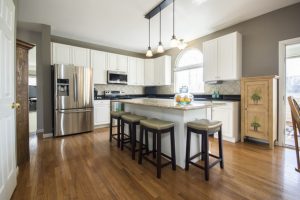 An elegant and clean kitchen with hardwood floors.
