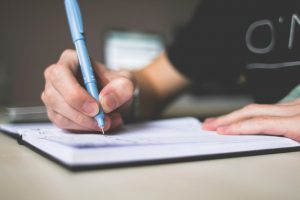 A person making the list from The lazy person's guide to the ideal home