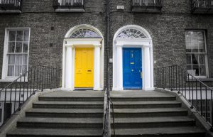 Bright blue door next to bright yellow door